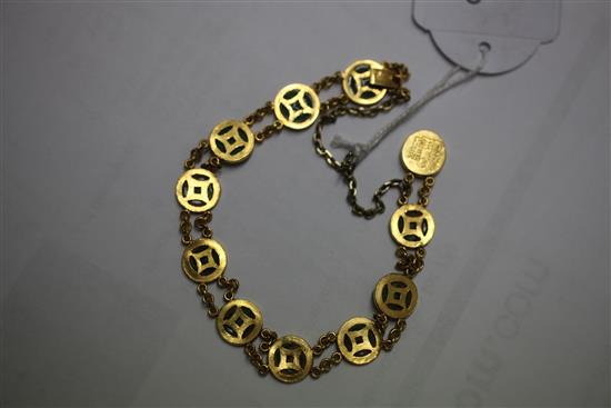 A Chinese high carat double chain link gold and jadeite bracelet, 6.5in.